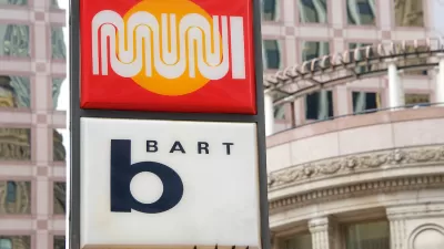 Close-up of sign at outdoor transit station for MUNI and BART in San Francisco, California.