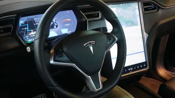 Interior of Tesla car with dashboard.