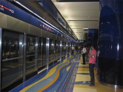 Dubai Metro: On the subway platform at Khalid Bin Al-Waleed, with automated doors that lead to the driverless trains.