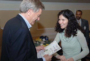 Planetizen Correspondent Lainie Herrera presents Bruce Babbitt with his Planetizen Top 10 Book Award certificate.