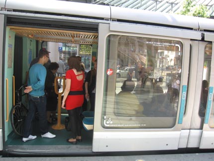 PHOTO: The open door of a tram, with a bicycle seen inside.