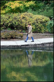 Photo: a woman walking in a park.