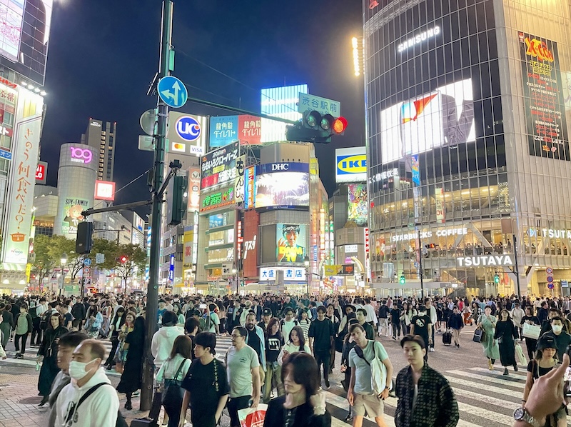 Busy Shibuya Scramble intersection in Japan at night.