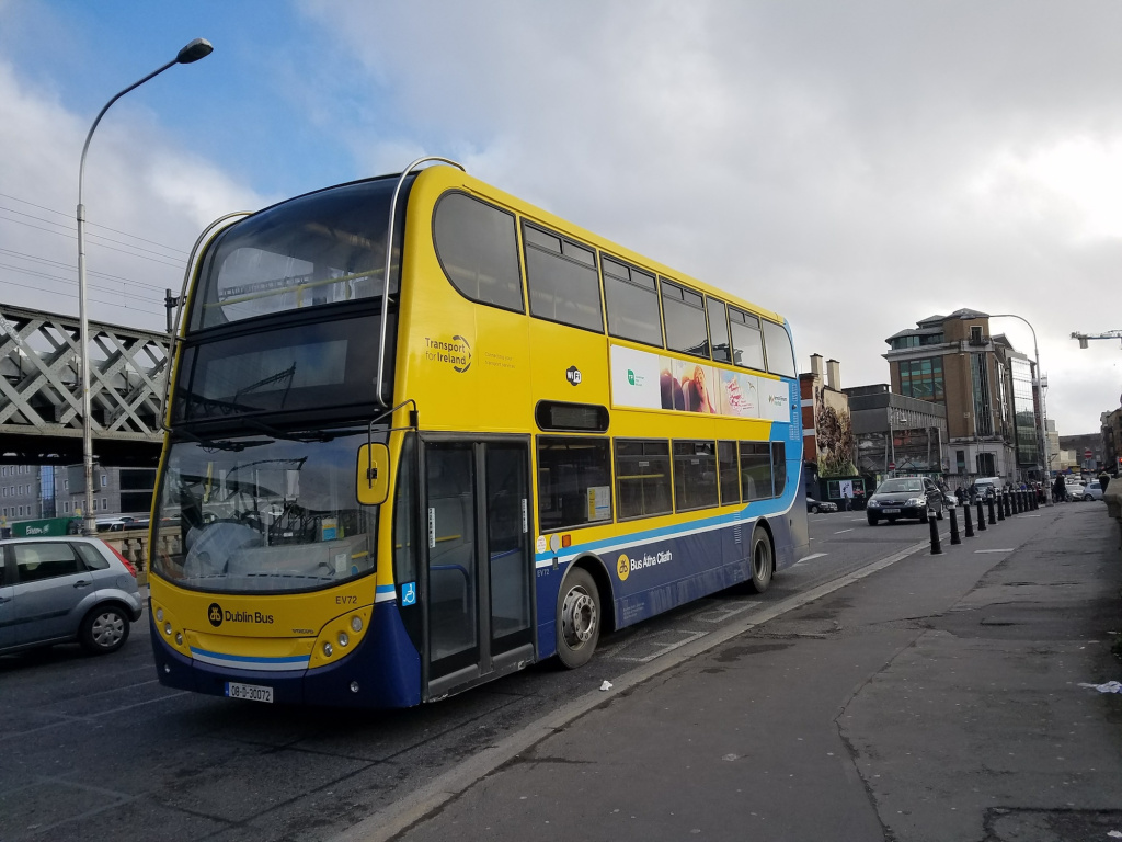 Blue and yellow double-decker transit bus with one front door.