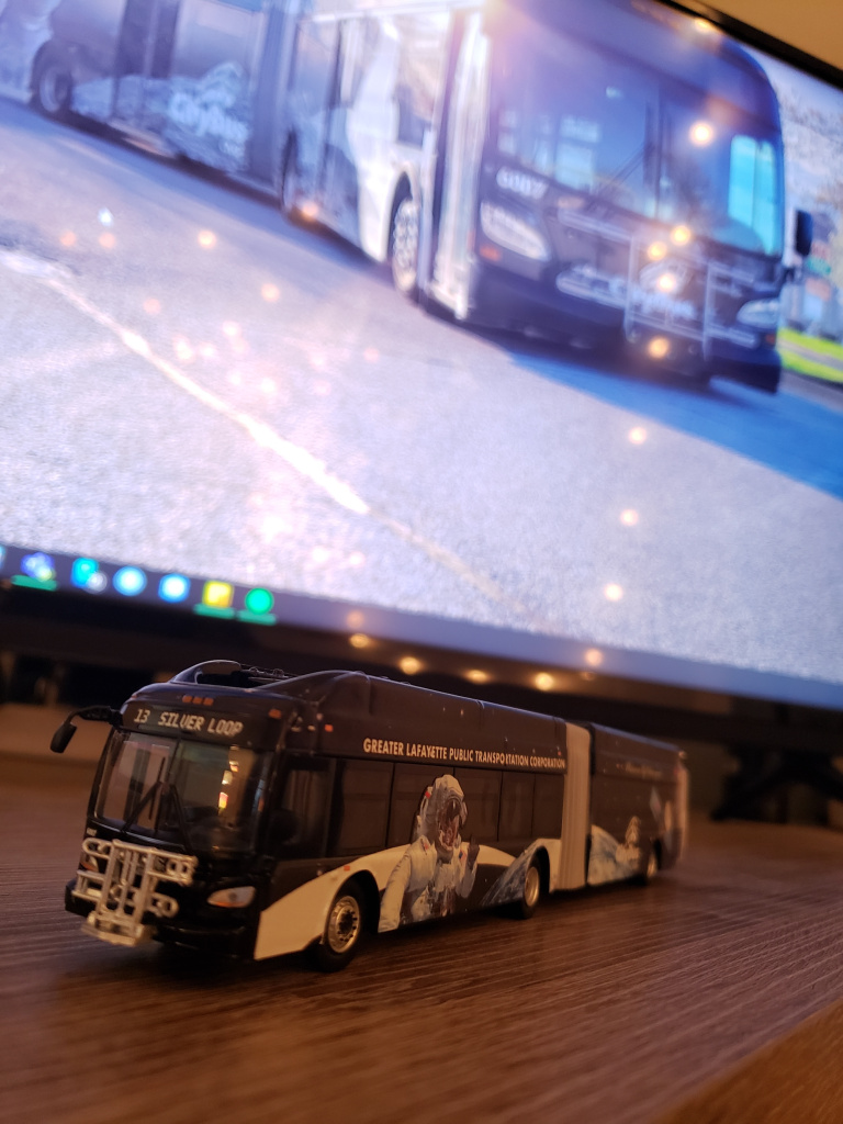 Diecast model of articulated bus.