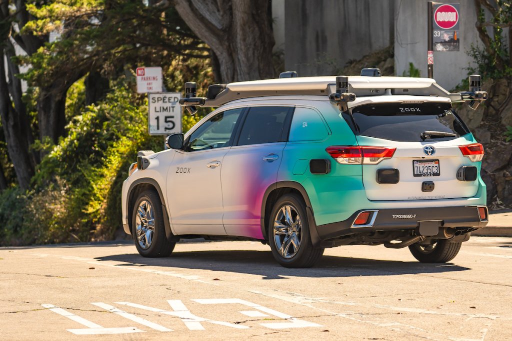 White Zoox SUV autonomous vehicle on street in San Francisco, California.
