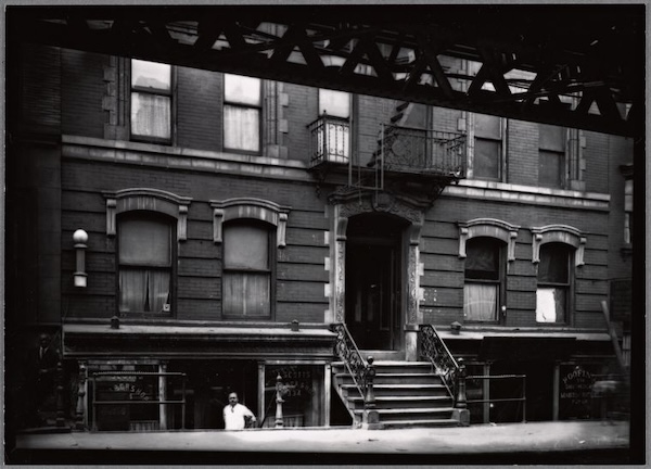A barber shop in a tenement basement