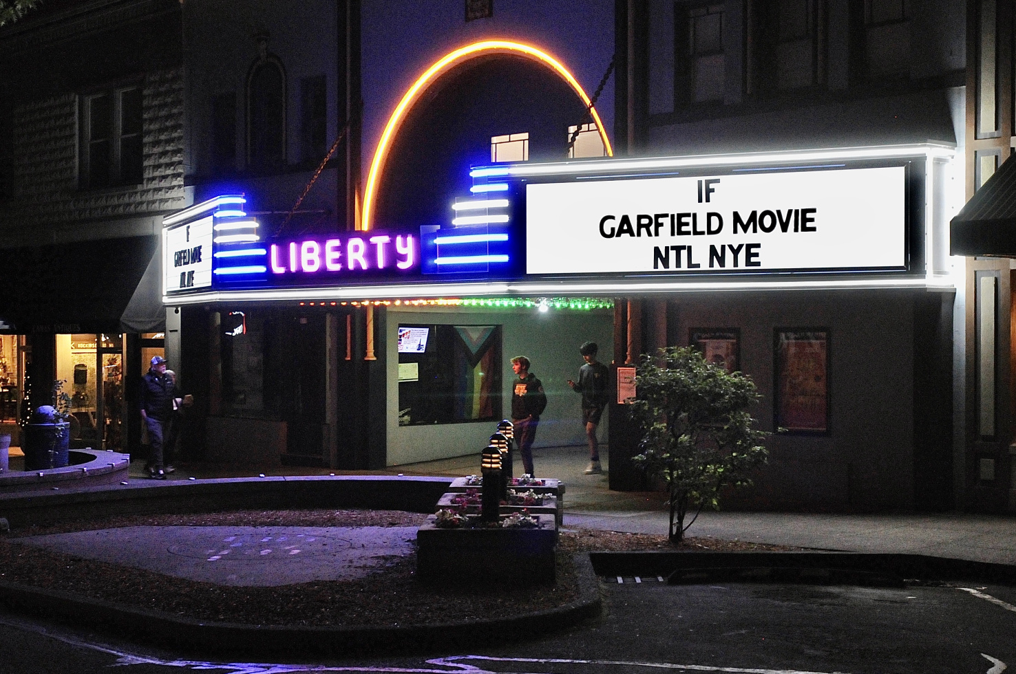 the liberty theater, with neon strips, playing If, Garfield Movie and NTL NYE