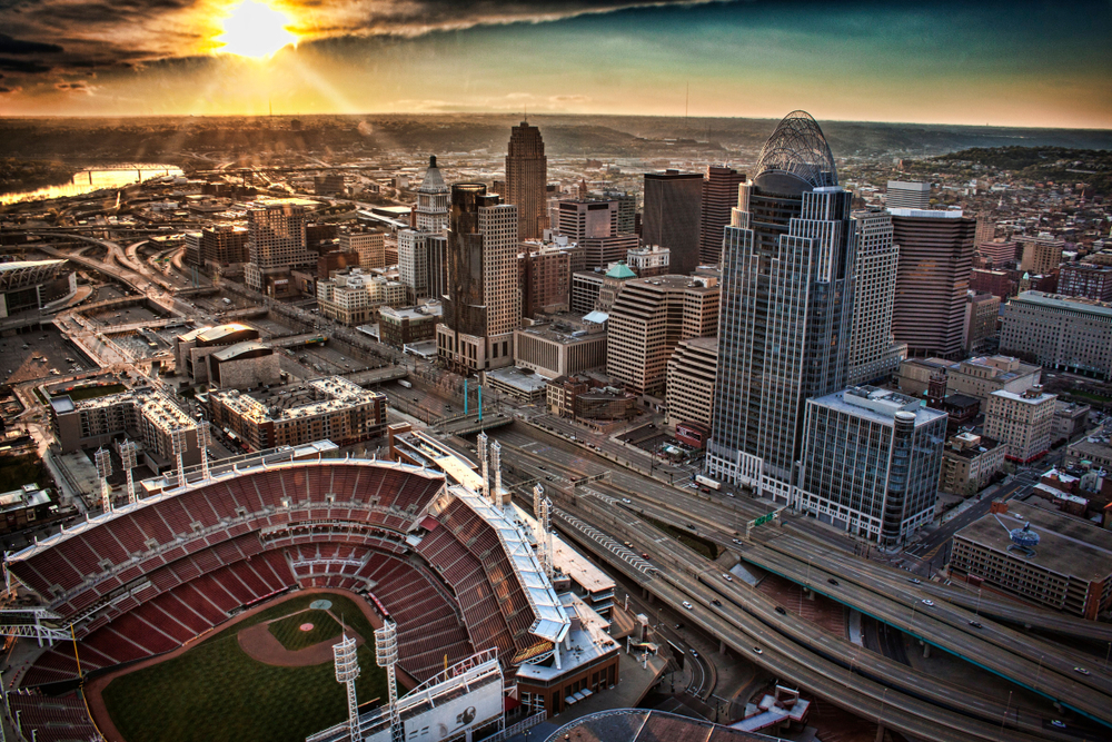 The skyline of downtown Cincinnati, with a major league baseball park in the foreground.