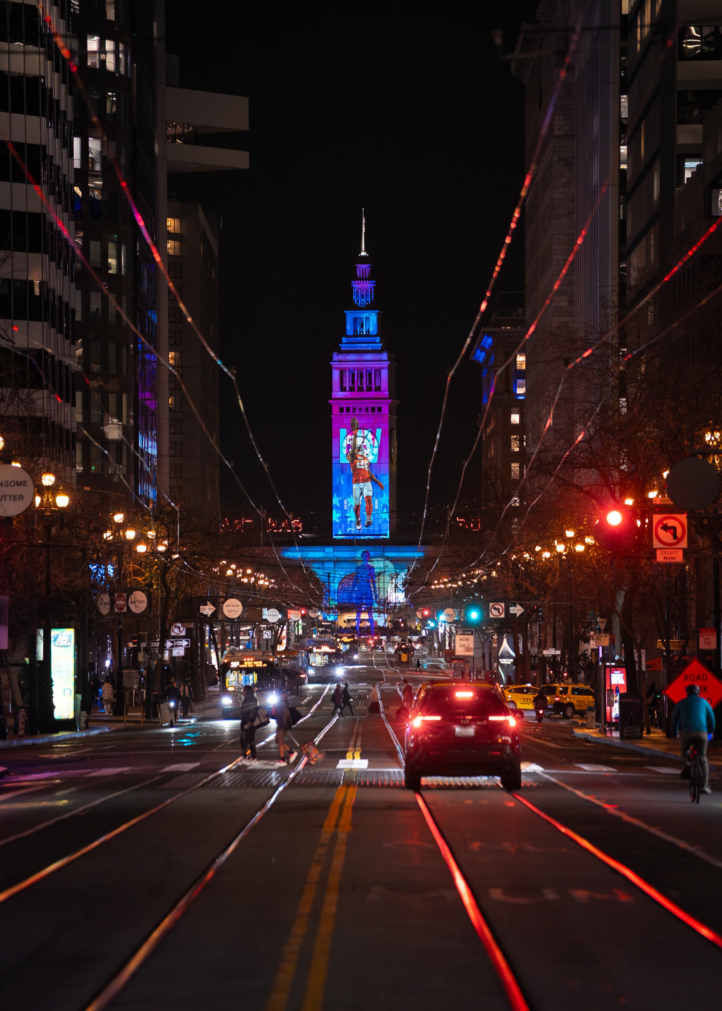 Super Bowl projection on tower in San Francisco, California at night.