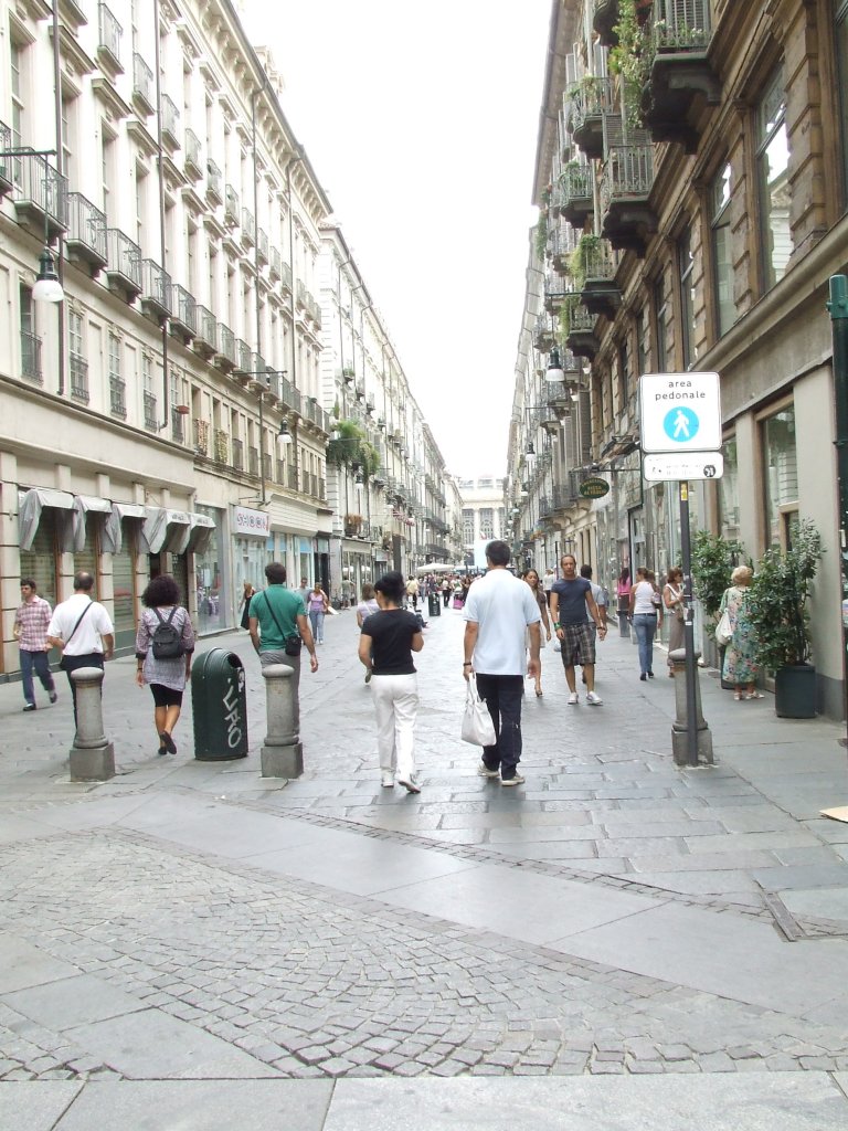 People walking on pedestrian-only street in Italy