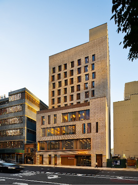A high-rise apartment building in an urban setting.