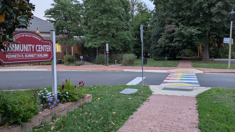 Red and white sign for Falls Church Community Center.