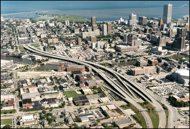 An historic aerial view over downtown Milwaukee, showing the now demolished Park East Freeway.