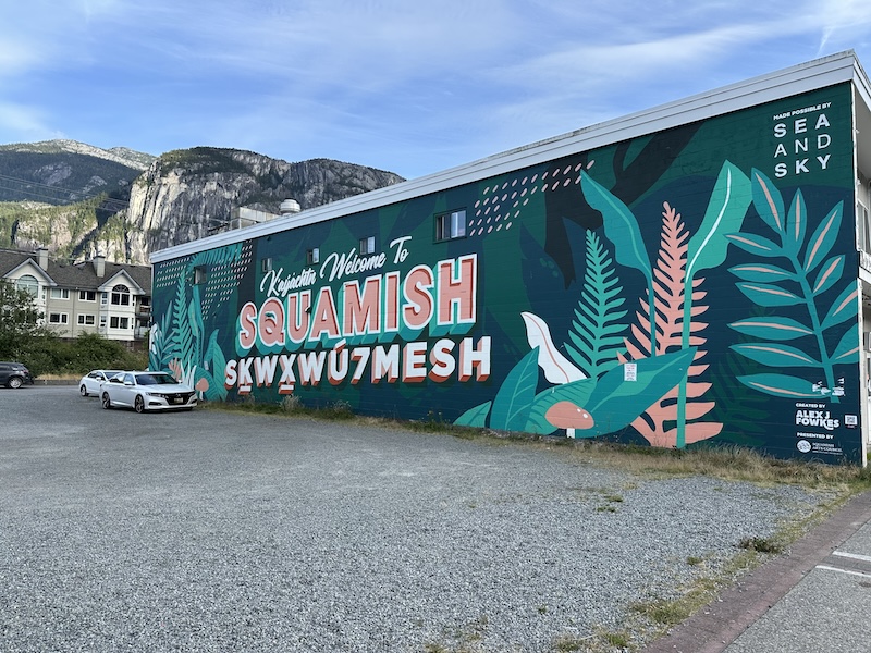 Squamish town name mural on green wall in Squamish, BC.
