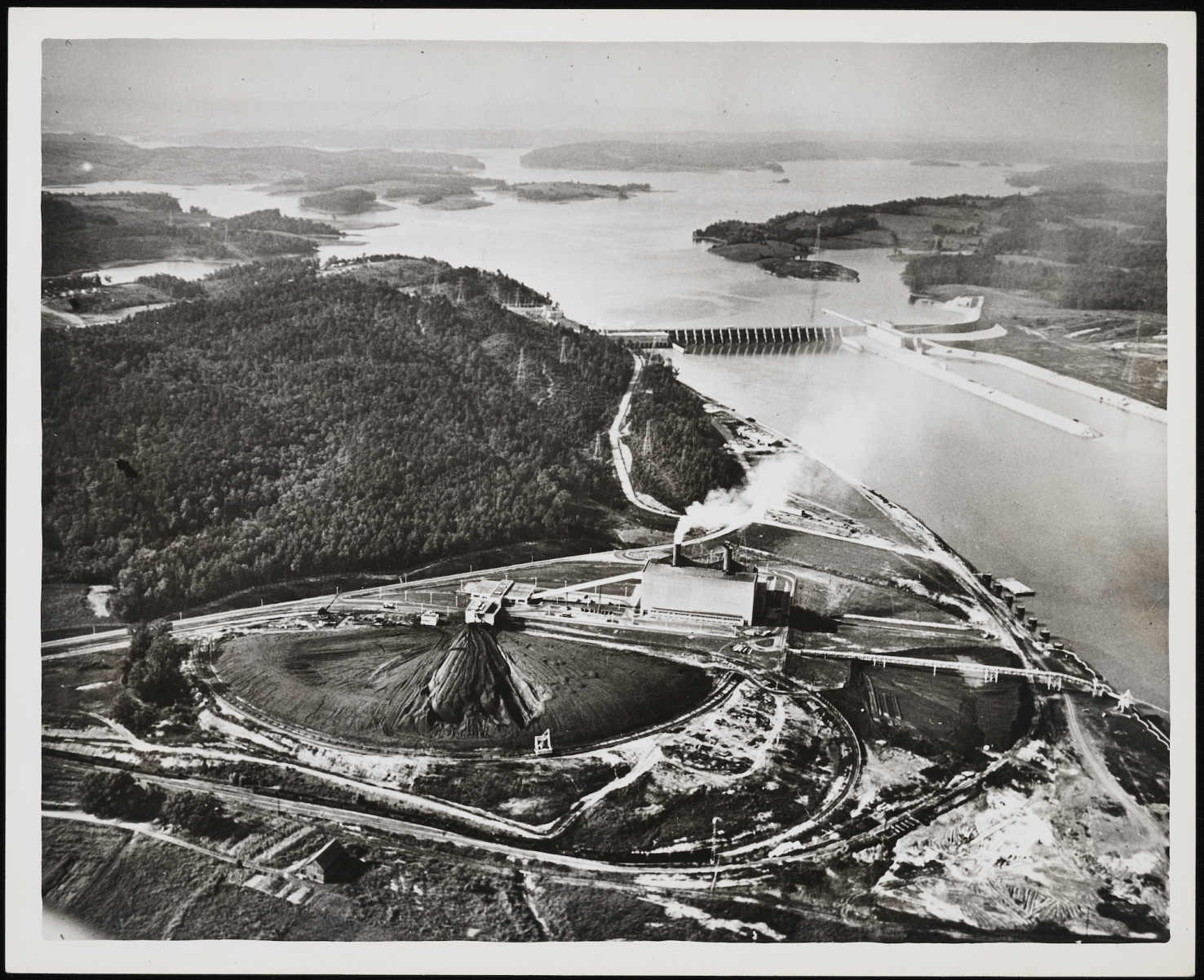 Aerial photo of dam and industry.