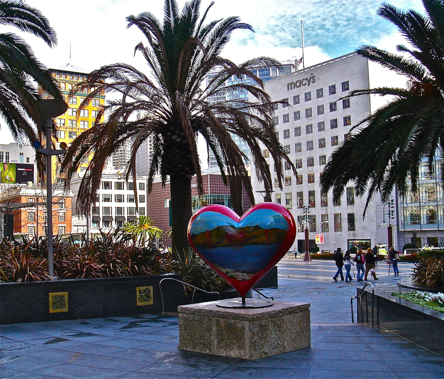 Street scene in San Francisco, CA with heart-shaped public art sculpture in public plaza.