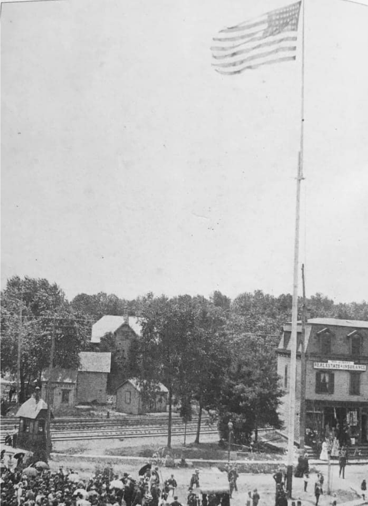 Historical photo of flagpole in Eastman Clock Plaza.