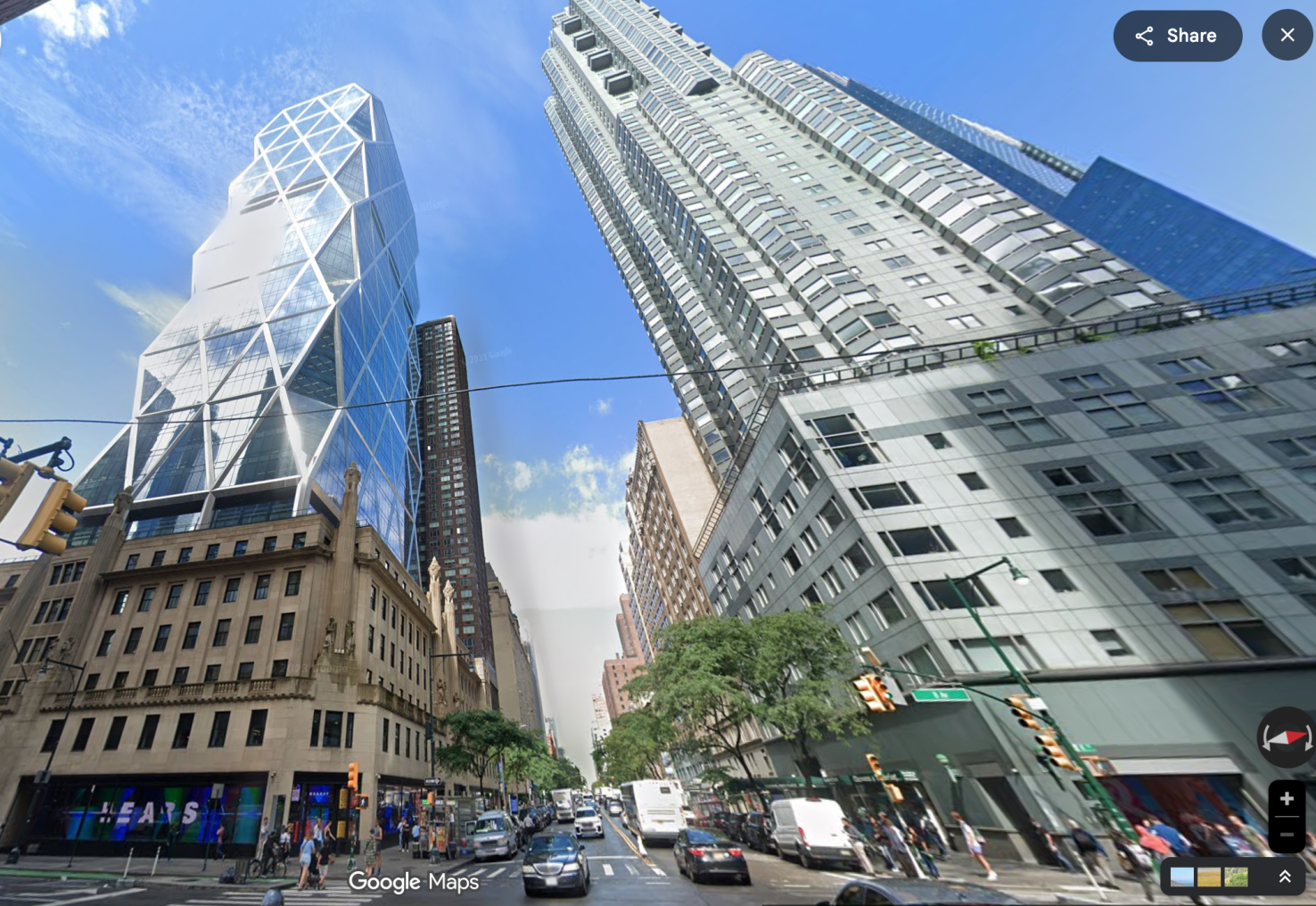 Tall glass buildings against blue sky in New York