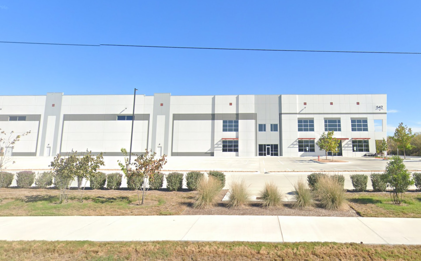 Street View of white and grey warehouse facility purchased by ICE in San Antonio, Texas.