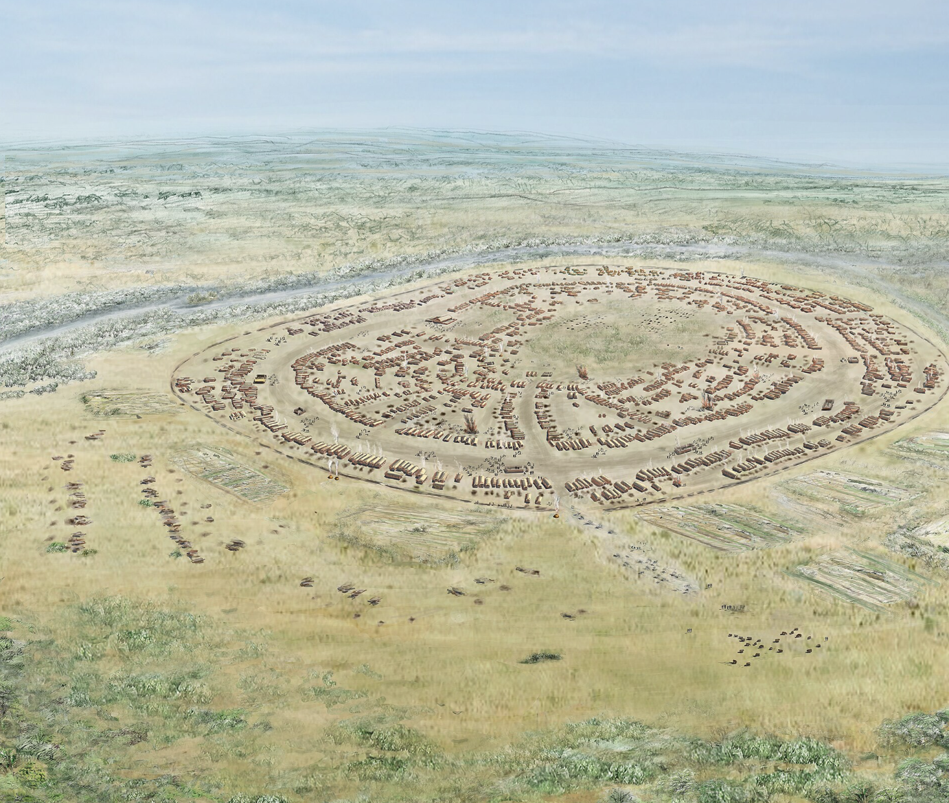A reconstruction of a Trypilla settlement. On green grass, small homes are built in a circular formation, surrounding a circular patch of grass.