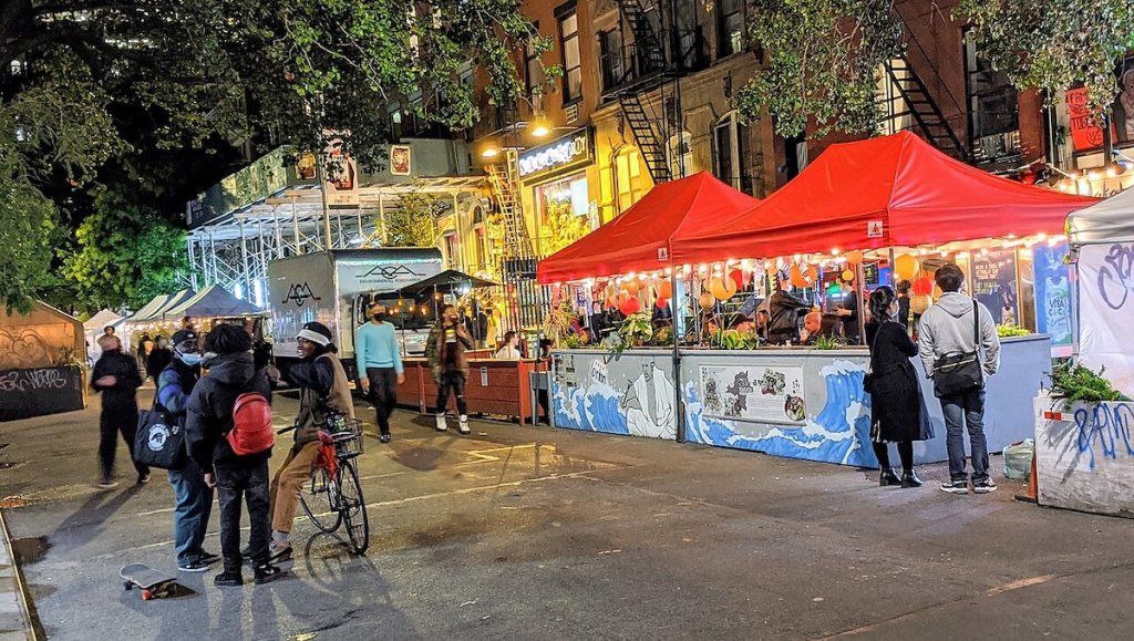 Outdoor dining kiosks in St. Mark's Place in New York City during Covid-19 pandemic.