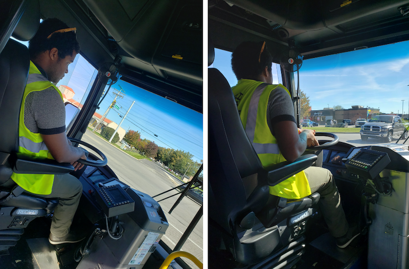 Joshua Woods in the driver's seat of a bus.