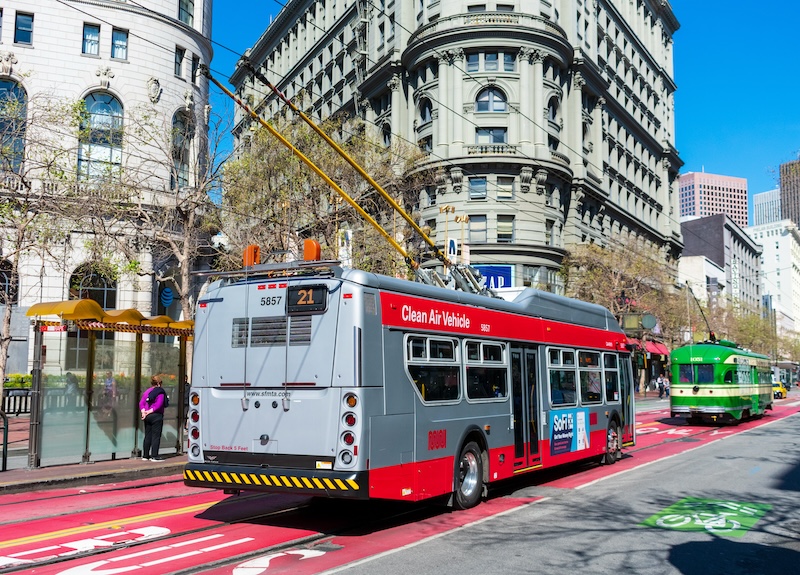 Busses and trolleys navigate San Francisco’s bright red transit-only lanes