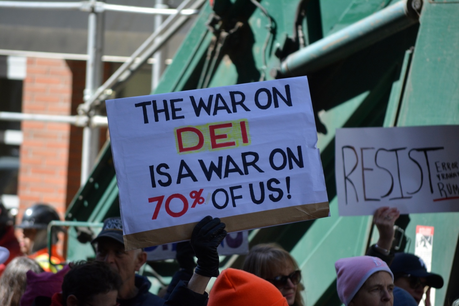 People carrying signs at an International Women's Day march in Manhattan.