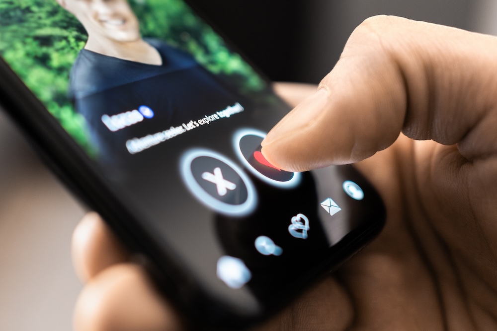 Close-up of dating app interface with profile photo. 