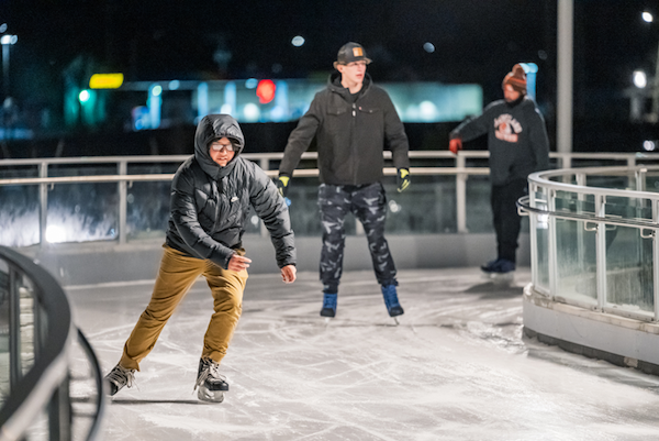 People skating in winter on The Ribbon skating trail in Toledo, Ohio.