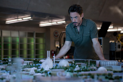 Photo: Robert Downey Jr. as Iron Man working in his lab.