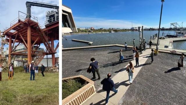 Image of building sites and people walking near a harbor