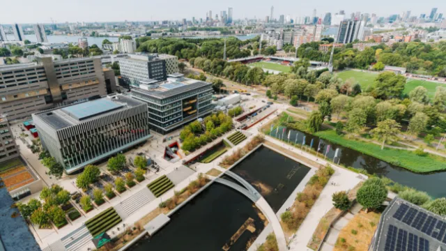 Skyline image of campus with waterways, buildings, and the city in the background