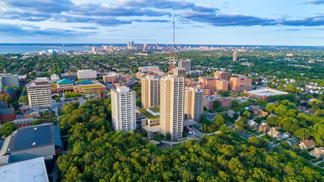 Ariel view of trees and tall buildings, UW Milwaukee school primary image