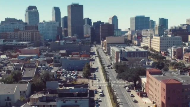 Top view of a city and streets with tall buildings in the distance