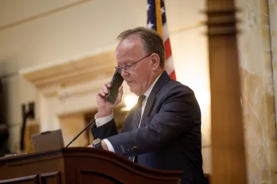 A man on the phone in the Utah senate