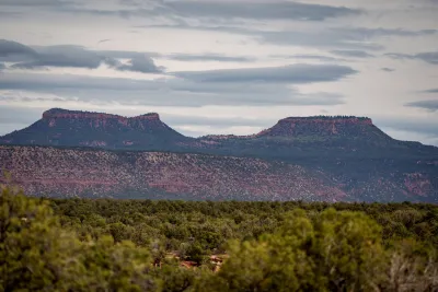 Two mountains with flat tops, resembling bear ears.