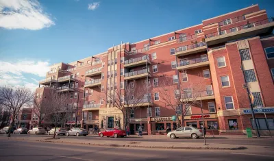 Red brick five-story multifamily housing building in Edmonton, Alberta, Canada.