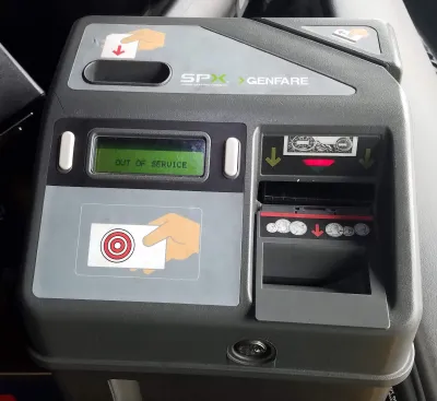 Close-up on fare box on bus.