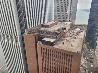 Aerial view of rooftop of 25 Water Street building in New York City with redevelopment work going on on rooftop.