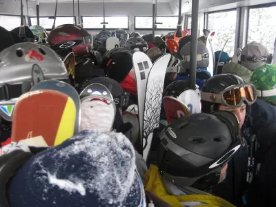 skiers on a tram