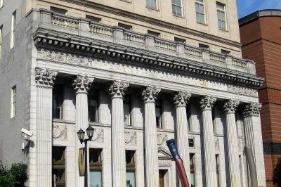 Historic Firemen's Insurance building in Newark, NJ with neoclassical columns.