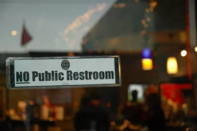 "NO Public Restroom" sign on restaurant window