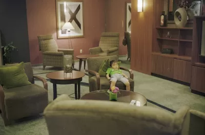 Hotel Lobby With Cute Sleeping Child