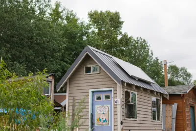 A tiny home in a Portland community with a solar panel on the roof.
