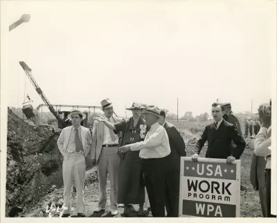 Eleanor Roosevelt talking with a project superintendent in Des Moines, Iowa. June 8, 1936. This project, sponsored by the Works Progress Administration, planned to convert a city dump into a water front park. 