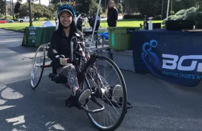Woman sitting on recumbent bike