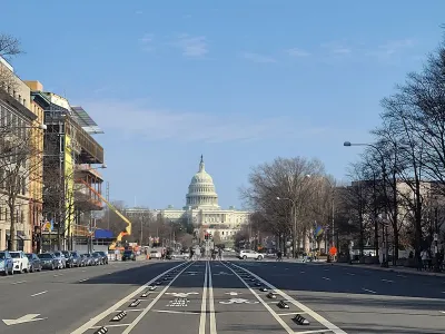 The Capitol dome in Washington, D.C. viewed from middle of Pennsylvania Avenue protected bike lanes.