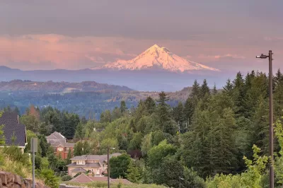 View of Mount Hood at golden hour with Happy Valley, Oregon homes in foreground.